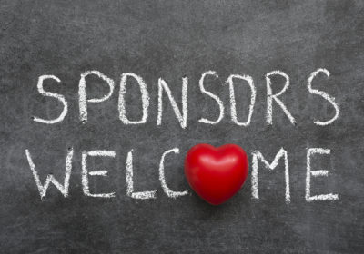 sponsors welcome phrase handwritten on chalkboard with heart symbol instead of O
